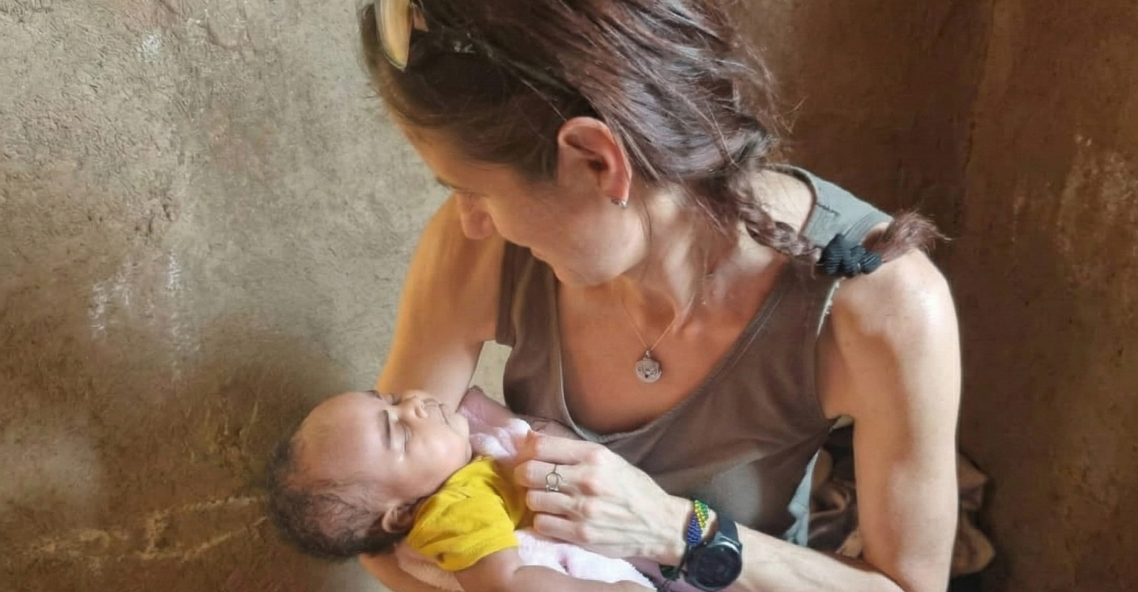 Claudia with newborn during home visit